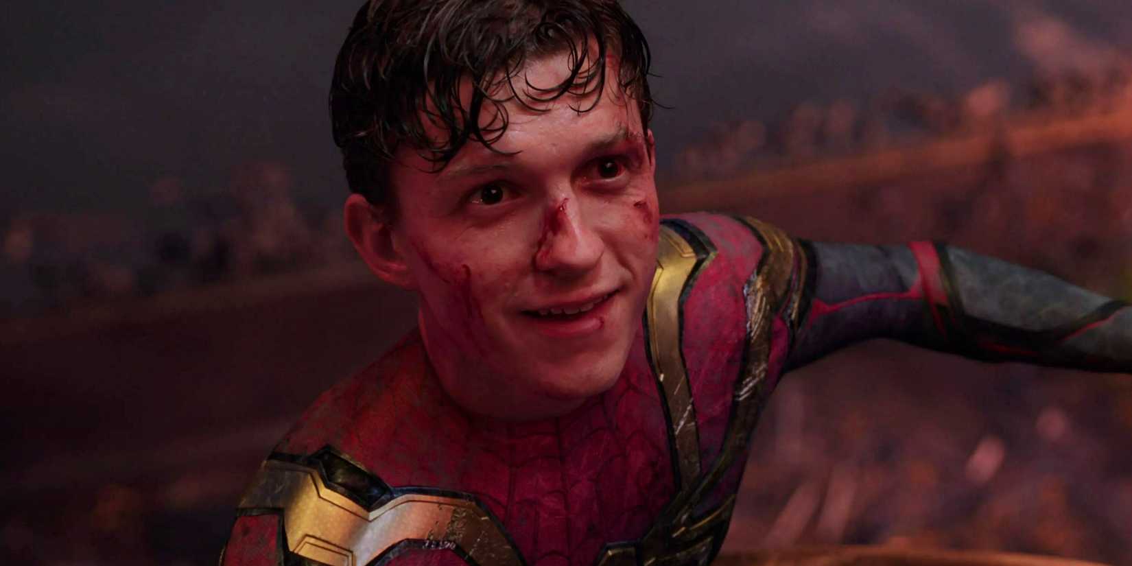 Tom Holland as Spider-Man smiling covered in wounds in Spider-Man No Way Home